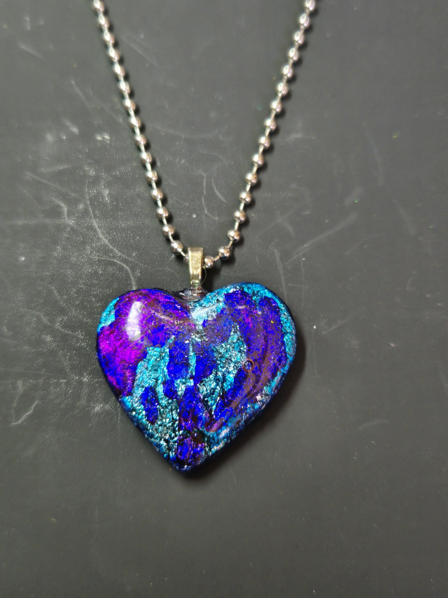 Full view of the alcohol ink heart pendant on its silver-tone ball chain