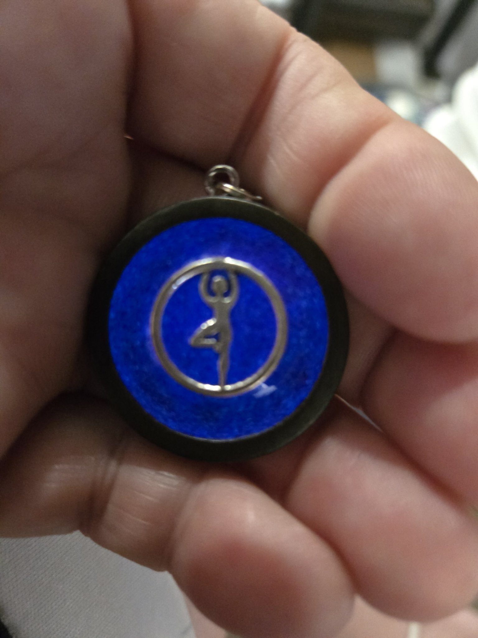 Stock 167 dancer pendant glowing bright blue in the dark