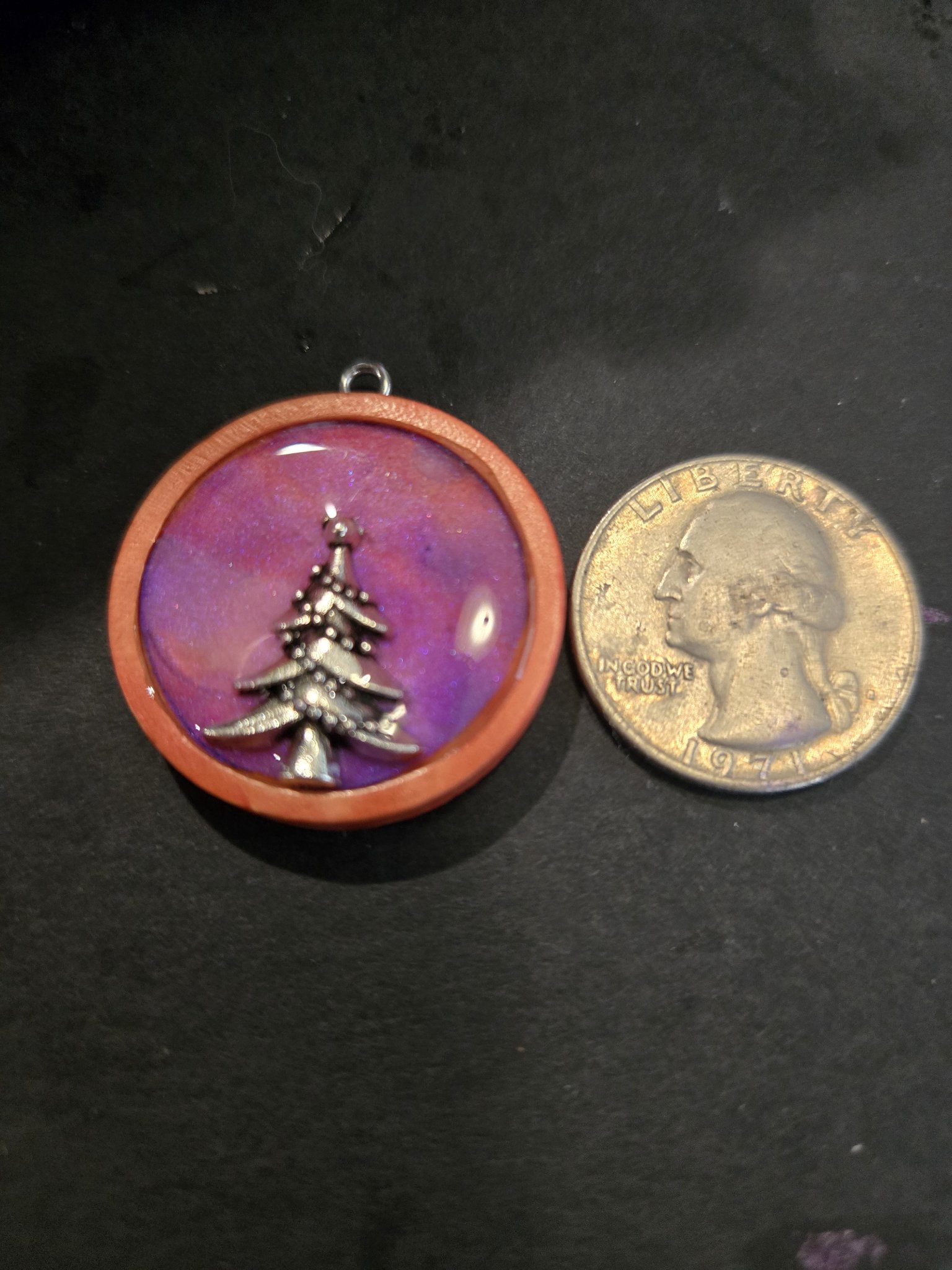 Stock 196 Christmas tree pendant shown beside a quarter for scale