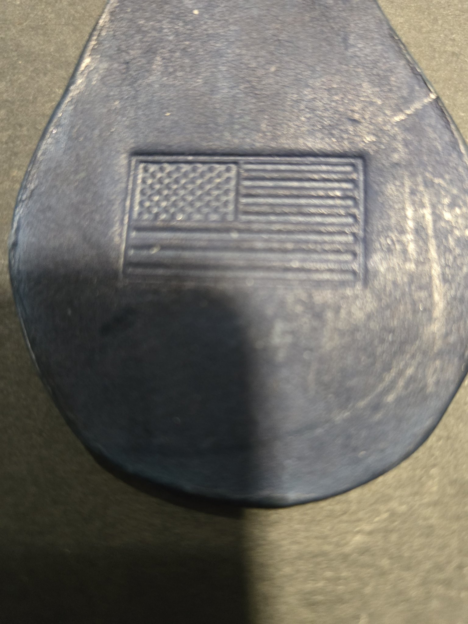 Close-up of stock 239 showing the embossed American flag in the dark blue leather