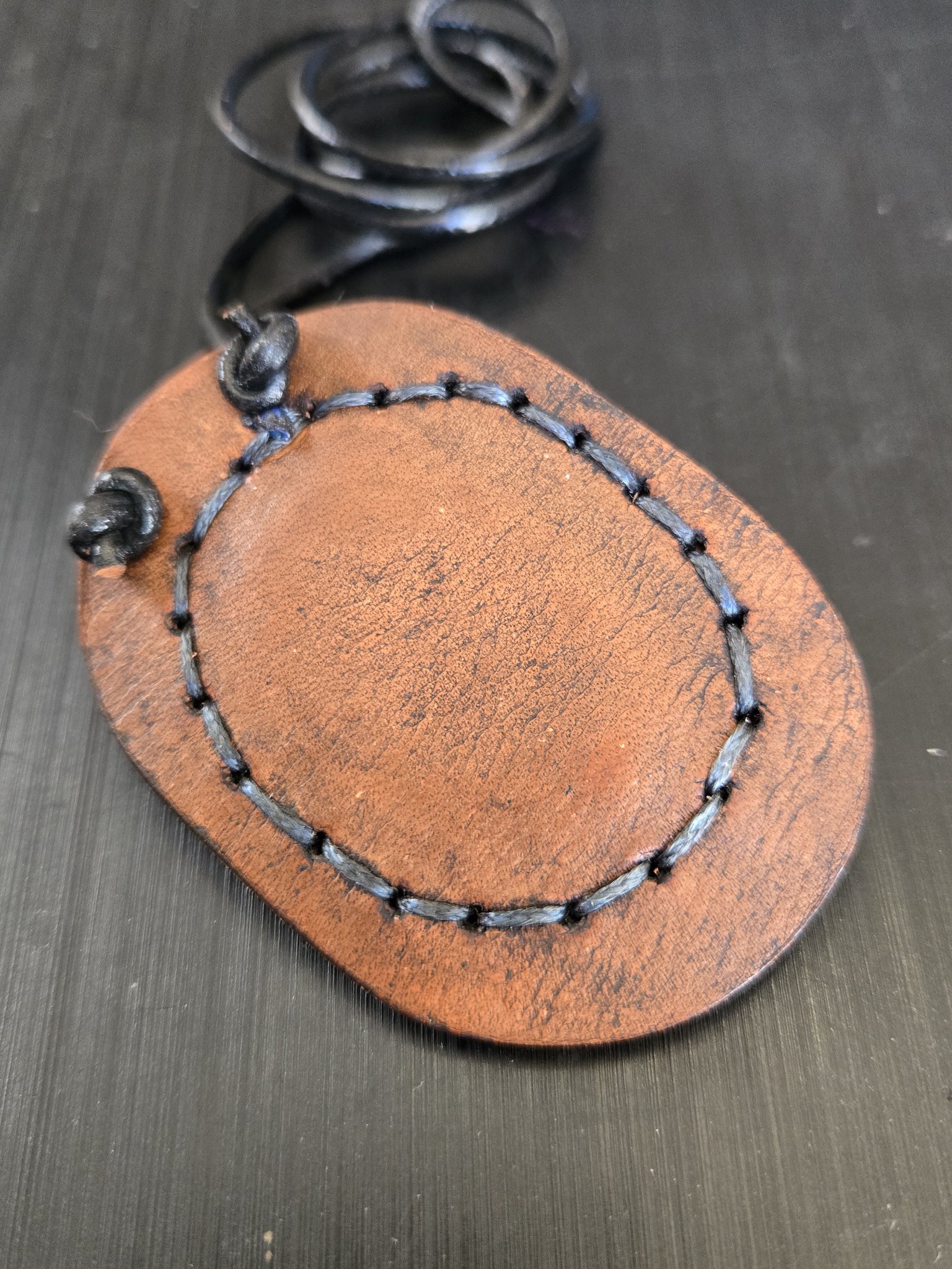 Plain brown leather back of stock 181 hand-sewn lapis pendant