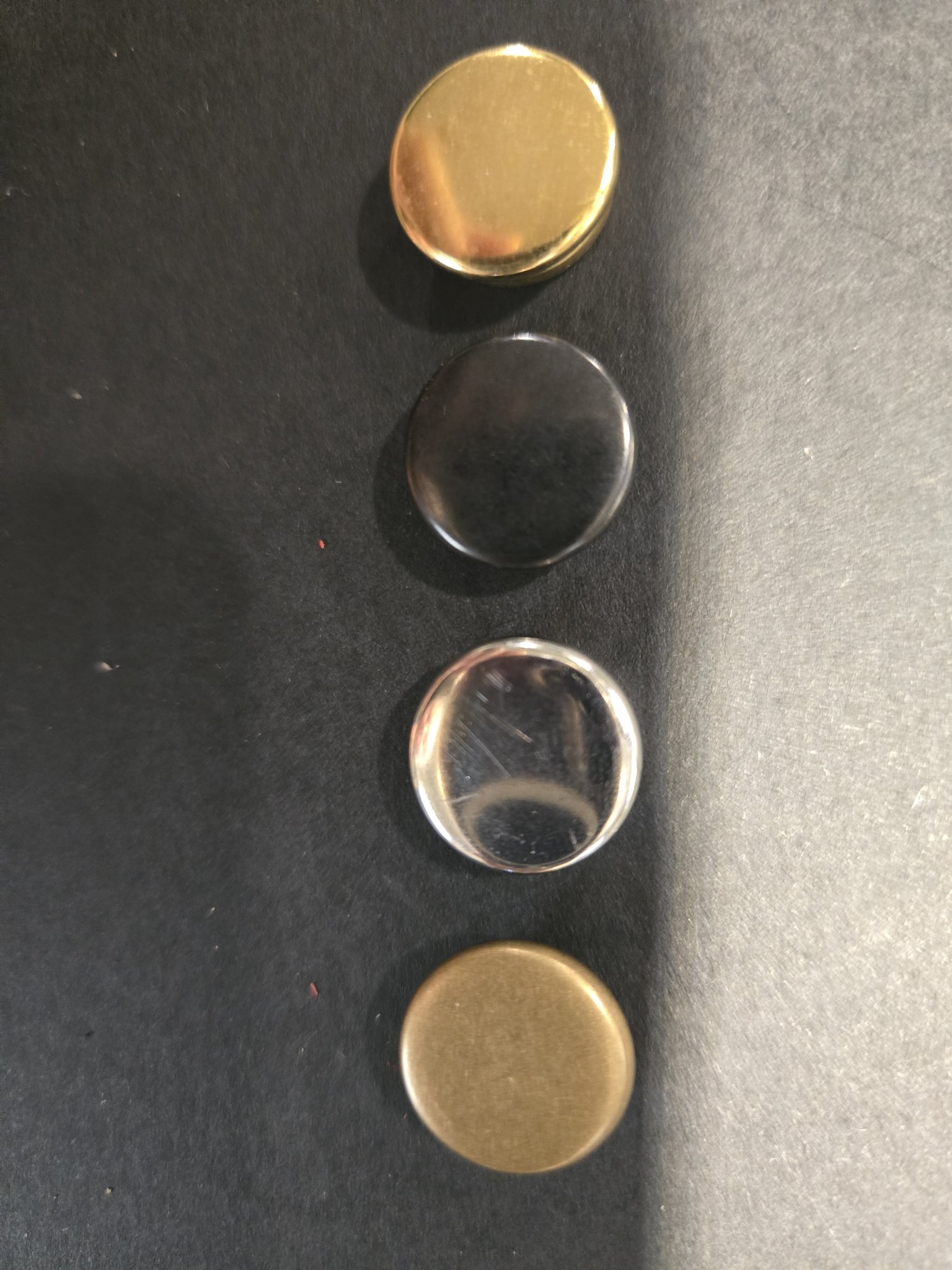 Snap color choices shown together: gold, black, silver, and bronze