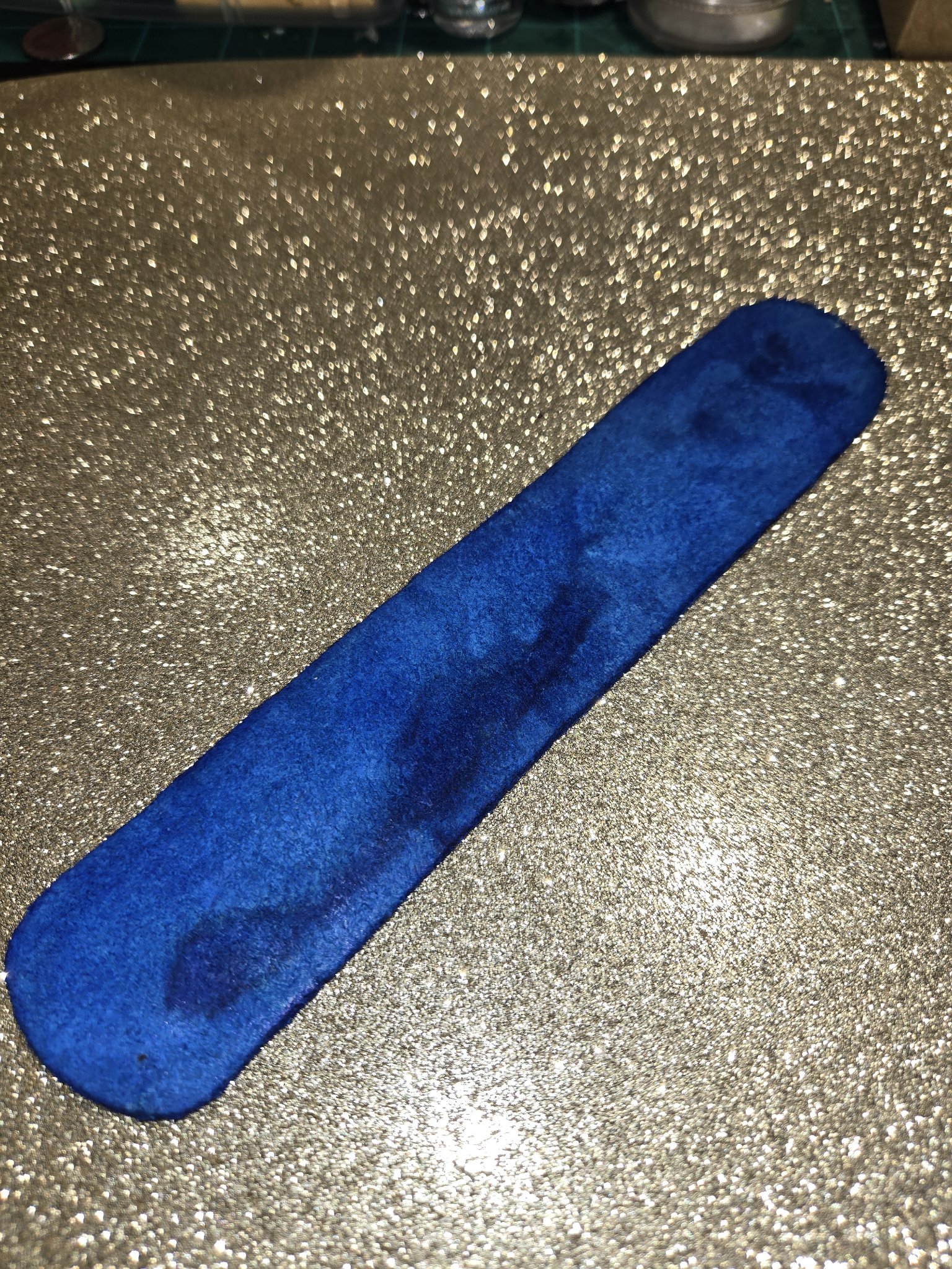 Back of stock 211 blue leather cuff showing the smooth blue leather surface