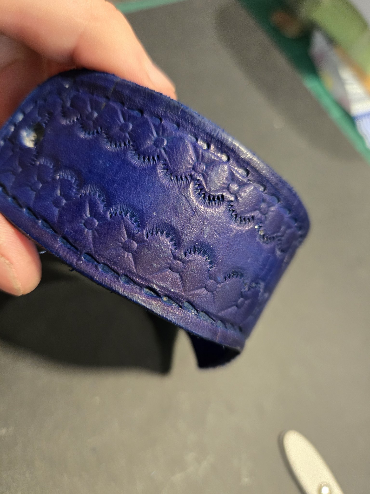 Angled view of stock 217 showing the blue leather and floral handstamping