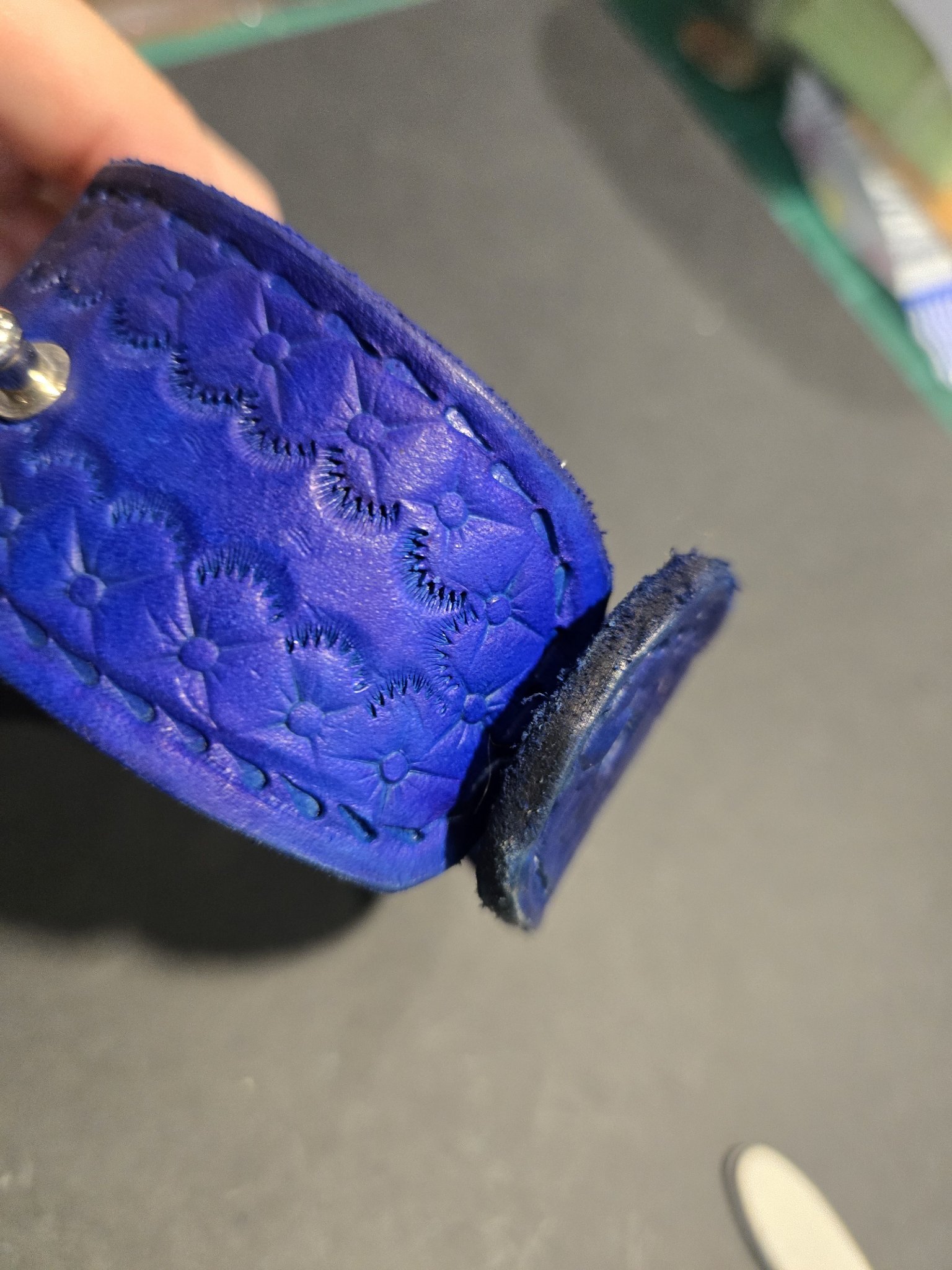 Open view of stock 217 showing the button closure and handstamped floral design