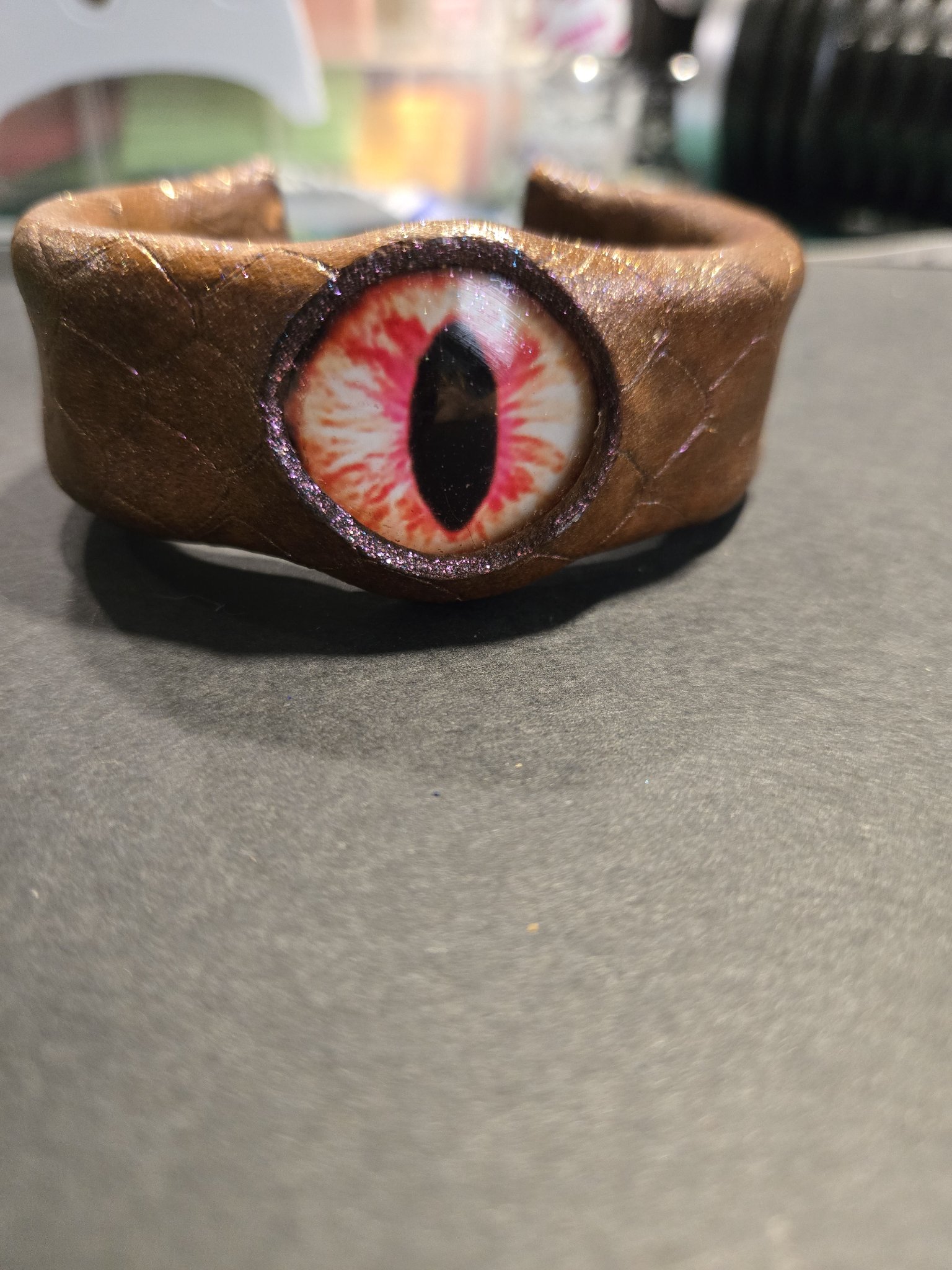 Front view of stock 218 showing its red and cream dragon eye and brown leather with pinkish sheen