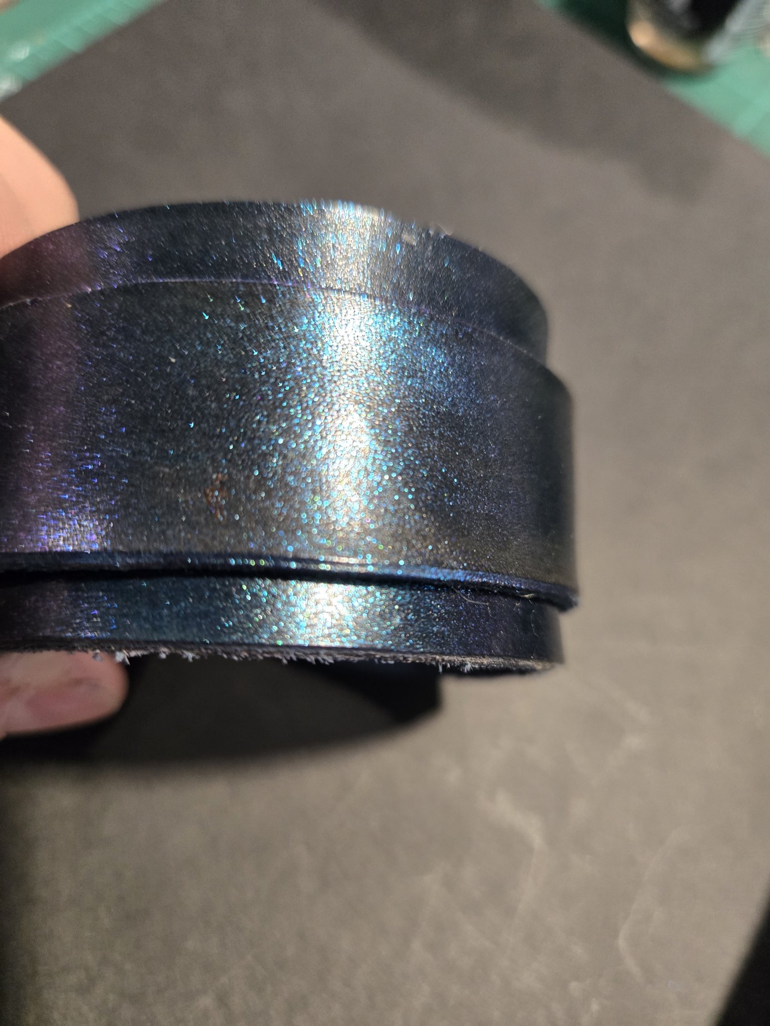 Angled view of stock 224 showing the blue and purple shimmer across the leather