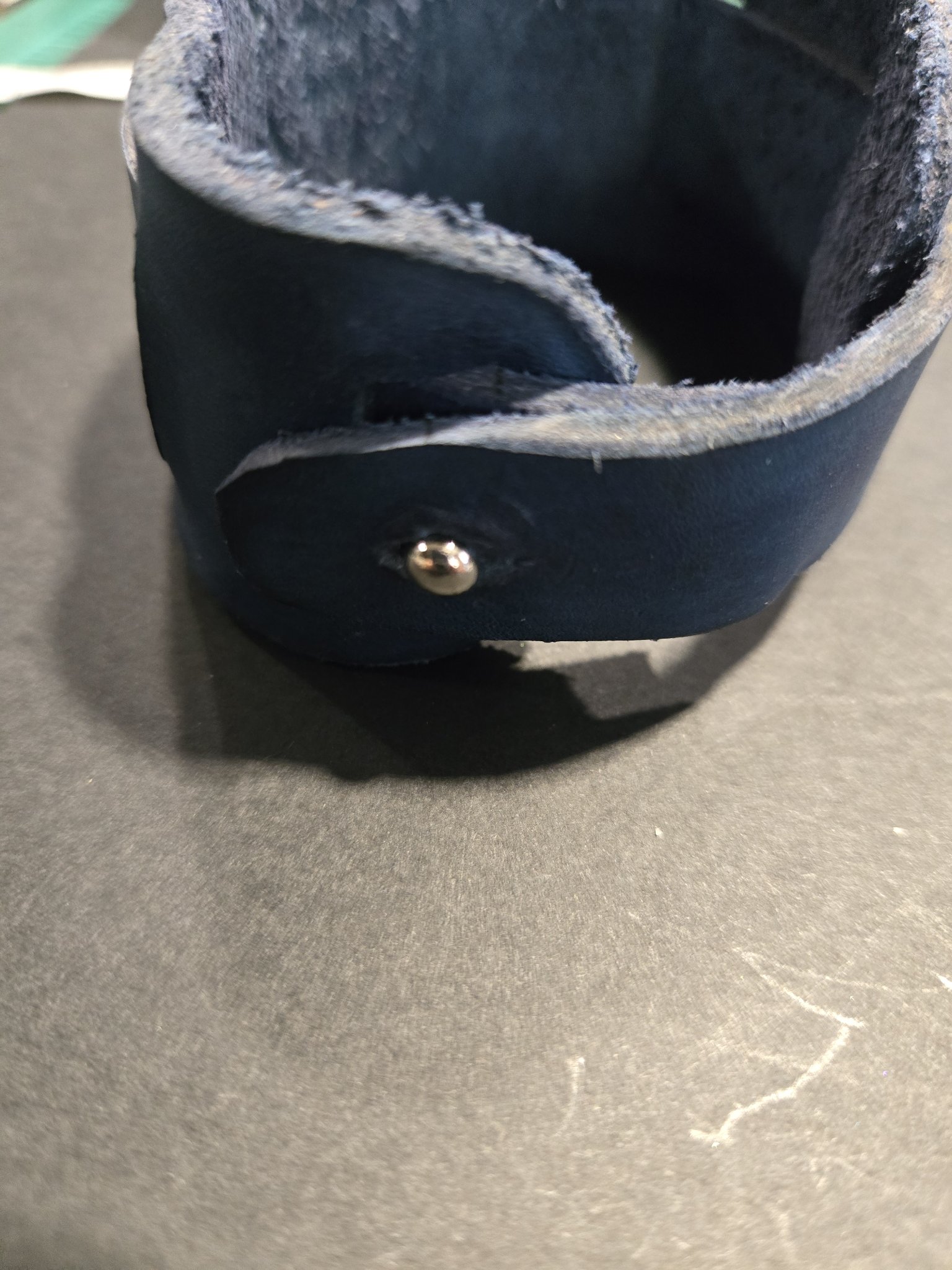 Close-up of stock 225 standing on display showing its button closure