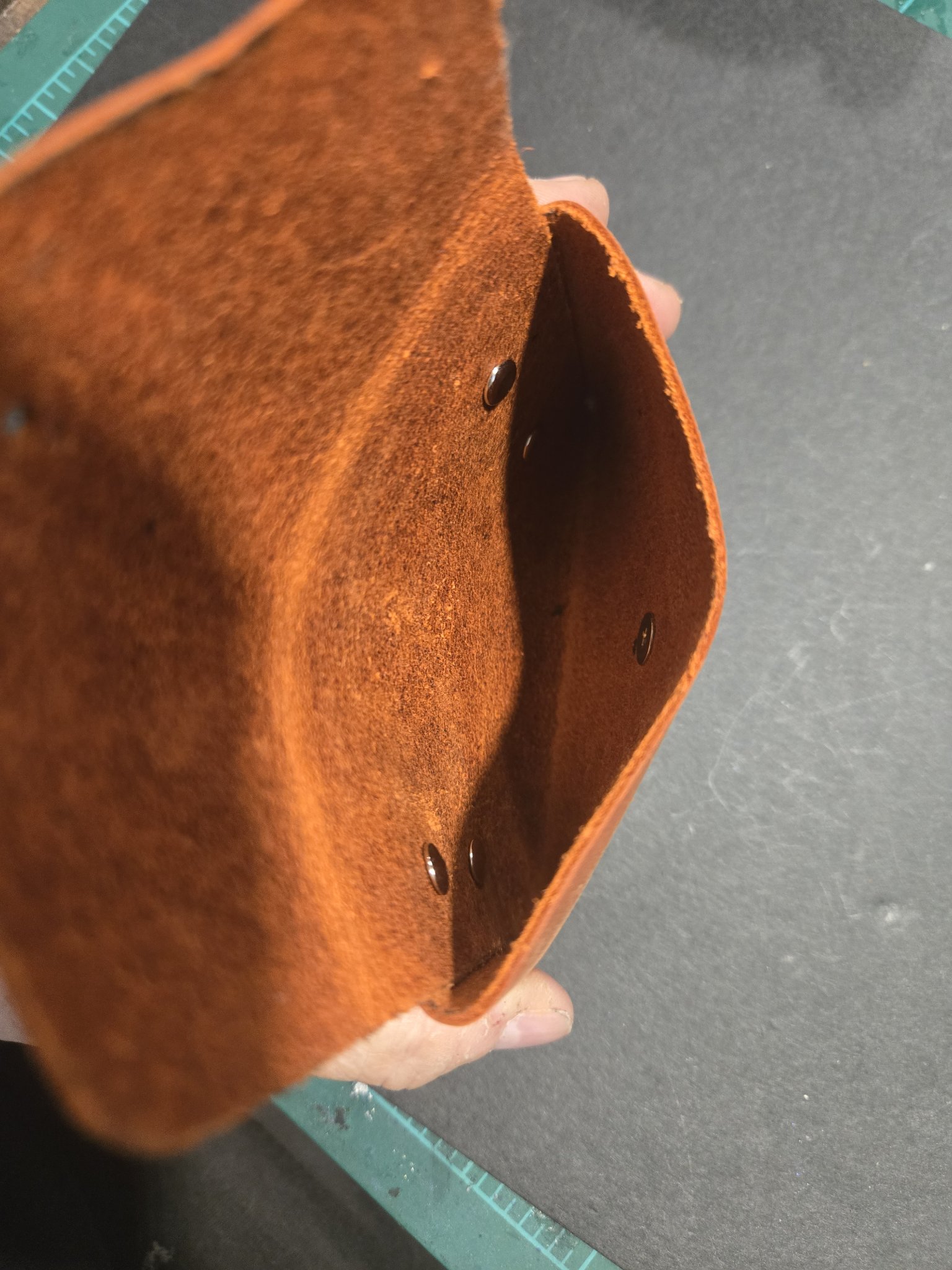 Close-up inside stock 242 showing the soft suede interior and the rivets